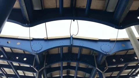 The blue structure is a bridge Stock Footage 313234568