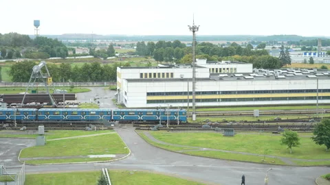 Blue subway train moving along railway tracks toward the depot Stock Footage 340831814
