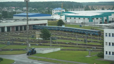 Blue subway train moving along railway tracks toward the depot 動画素材 340831841