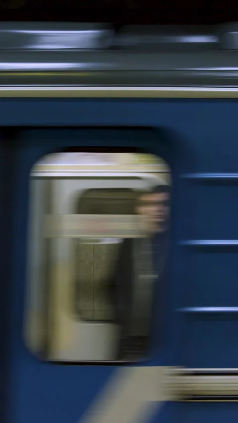 Blue subway train with people inside picking up speed, view from metro station Stock-Footage 282662256