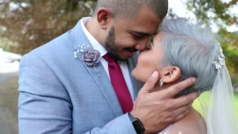 Blue Suit Red Tie Caressing Bride's Cheek Stock Footage 118812141