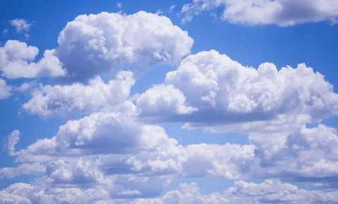 Blue summer sky with clouds background. Stock Photos