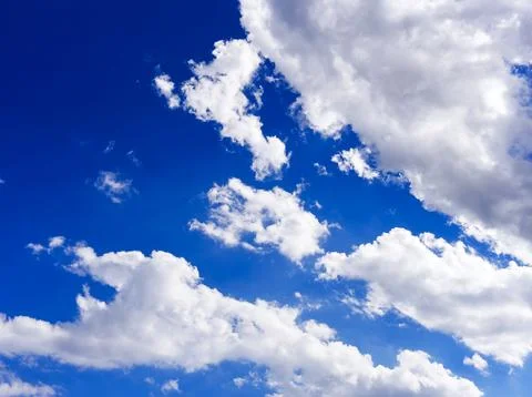Blue summer sky in clouds Stock Photos
