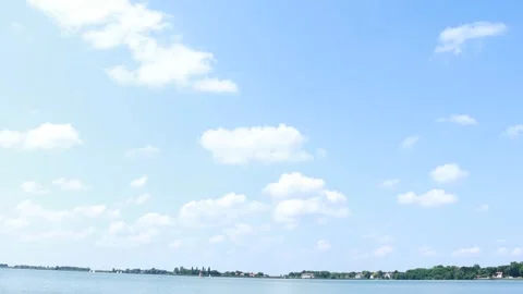 Blue Summer Sky with Fluffy White Clouds over Palic Lake Video stock 333554134