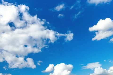 Blue summer sky with white clouds, background Stock Photos