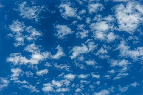 Blue summer sky with white clouds Stock Photos