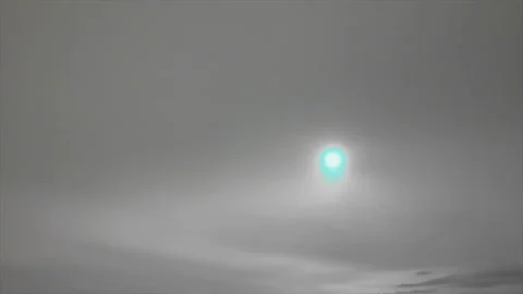Blue sun shining in cloudy sky Stock Footage 125580726