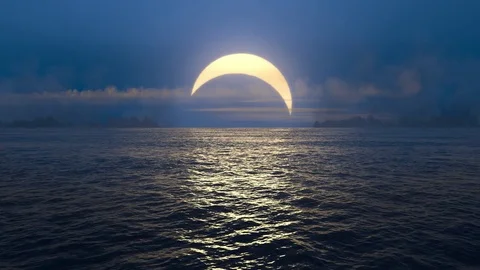 Blue sunset and solar eclipse over seamlessly looped ocean.  Stock Footage 81674011