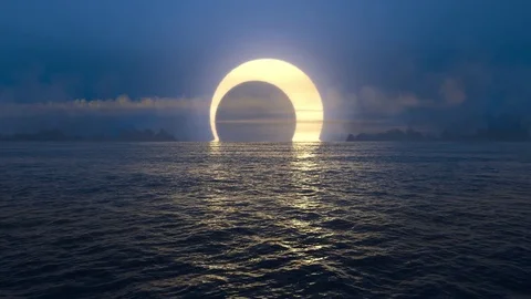 Blue sunset and solar eclipse over seamlessly looped ocean.  Stock Footage 82139627