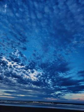 Blue sunset on the beach Stock Photos