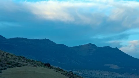 Blue sunset close up of distant desert sutton mountain as viewed from the Video stock 81801425