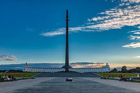 Blue sunset sky with clouds over the memorial in Victory Park on Poklonnaya h Stock Photos