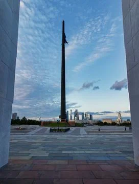 Blue sunset sky with clouds over the memorial in Victory Park on Poklonnaya h Stock Photos