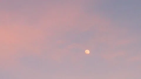 Blue Sunset Sky Moon and Light Orange Clouds in Sunlight Slow Motion, Time Lapse Video stock 309090856