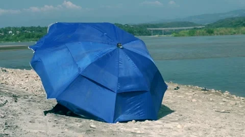Blue sunshade on the beach Stock Footage 45479635