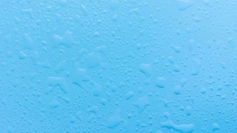 Blue surface with droplets and splashes of clear water. Move the camera Stock Footage 90424778