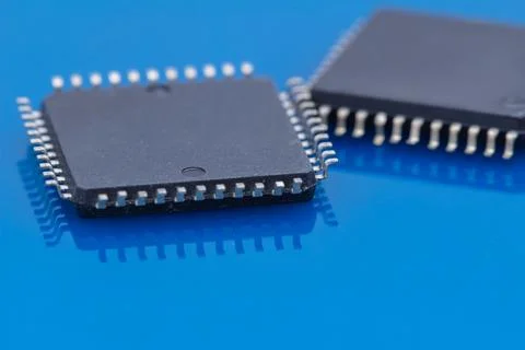 Blue surface holds two microchips Stock Photos