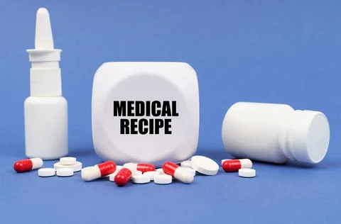 On the blue surface of the pill, capsule, spray, jar and cube with the inscri Fotos Stock