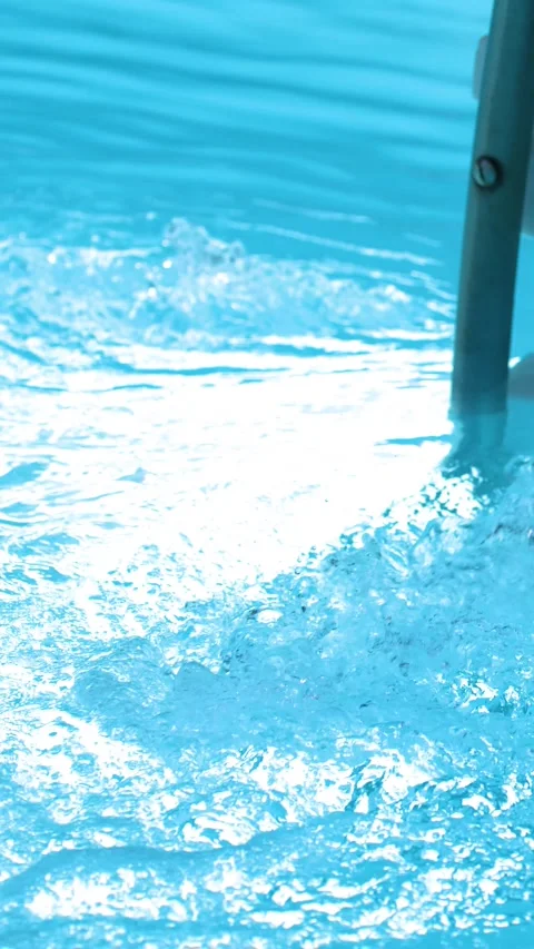 Blue Swimming Pool Water Circulating Through a Jet Filter System Stock Footage 328629389