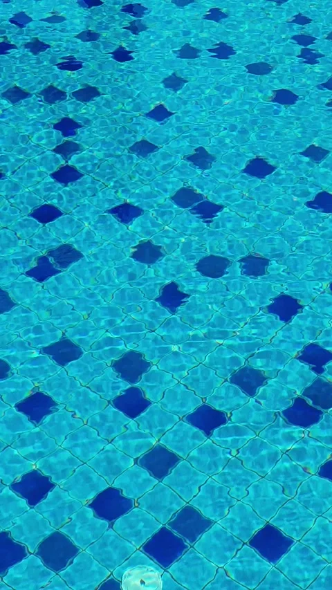 Blue swimming pool water with diamond tile pattern and ripples Stock Footage 346284397