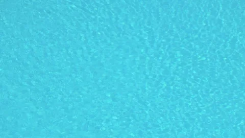 Blue swimming pool water surface ripple texture background Video stock 338384820