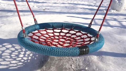 Blue swing on the playground in winter Vídeo Stock 171961990