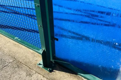 The blue synthetic grass surface of a paddle tennis court, near the net 写真素材
