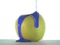 Blue Syrup Poured Over an Apple Vídeos