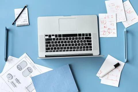 Blue table with laptop 스톡 사진