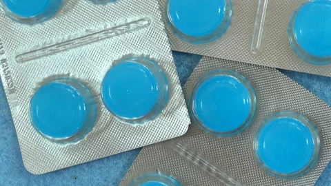 Blue tablets in blisters Stock Footage 139336798