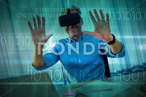 Blue technology design with binary code against businessman using an oculus Stock Photos