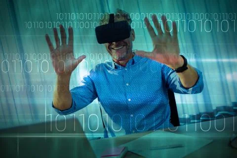 Blue technology design with binary code against businessman using an oculus 库存照片