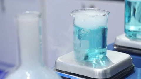 Blue test sample in a flask Stock Footage 73386408