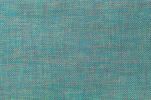 Blue textile background with chess pattern, closeup. Structure of fabric macr Stock Photos