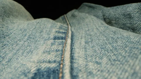 Blue textile jeans cloth texture close-up macro. Fashion fabric multicolor Stock Footage 263088008
