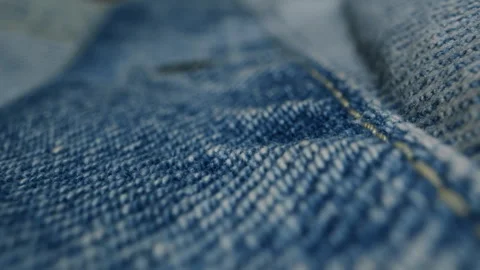 Blue textile jeans cloth texture close-up macro. Fashion fabric multicolor Stock Footage 285178746