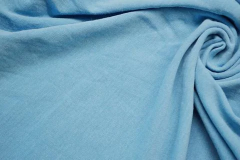 Blue textile pattern as a background. Blue material texture on fabric Stock Photos