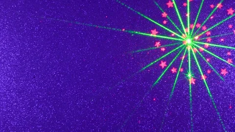 On a blue texture background, a flying pattern in green and red Vidéo 241293250