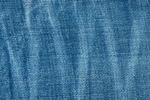 Blue texture background, jeans texture, fabric. Denim jeans background. Stock Photos