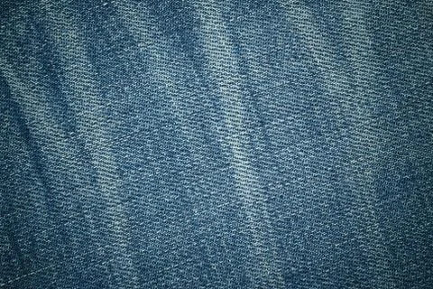 Blue texture background, jeans texture, fabric. Denim jeans background. Stock Photos