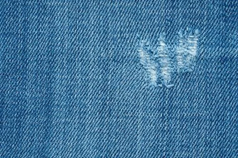Blue texture background, jeans texture, fabric. Denim jeans background. Stock Photos