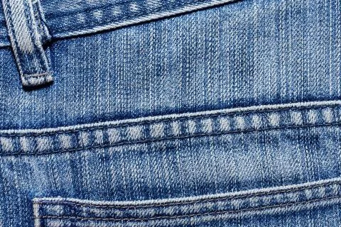 Blue texture background, jeans texture, fabric. Denim jeans background. Stock Photos