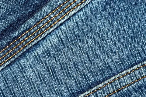 Blue texture background, jeans texture, fabric. Denim jeans background. Stock Photos
