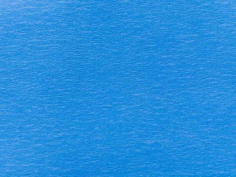 Blue textured background with subtle wavy surface pattern Stock Photos