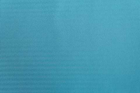 Blue textured background with a wavy pattern. Stock Photos