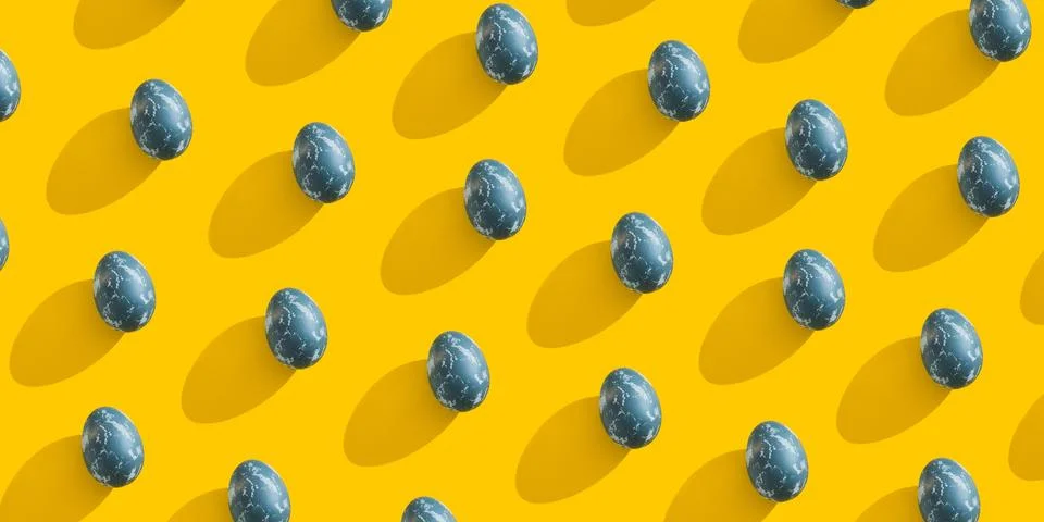 Blue textured colored Easter eggs on a bright yellow holiday background backdrop Stock Photos