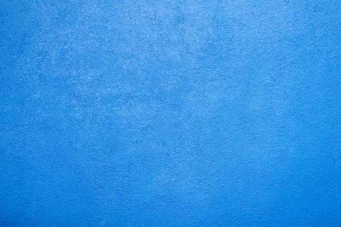 Blue textured concrete wall background with rough plaster surface Stock Photos