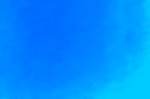 Blue textured wall. Abstract gradient background. Front view. Stock Photos