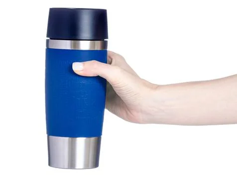 Blue thermo cup in hand Stock Photos