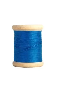 Blue thread bobbin isolated on white Fotos Stock